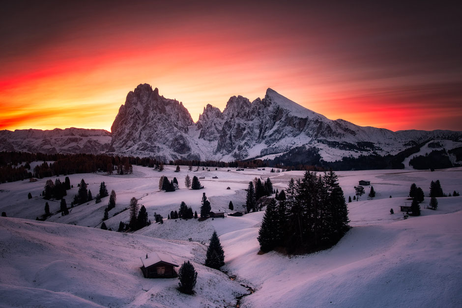 Alpi di Siusi at sunrise in early November after a snowfall 