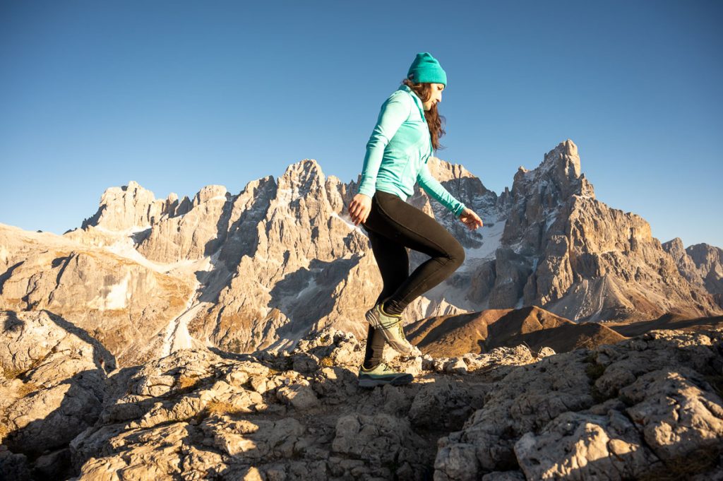 A Female Hiker on the Summit Of Monte Castellaz With Cima Della Vezzana and Cima della Palla in the background